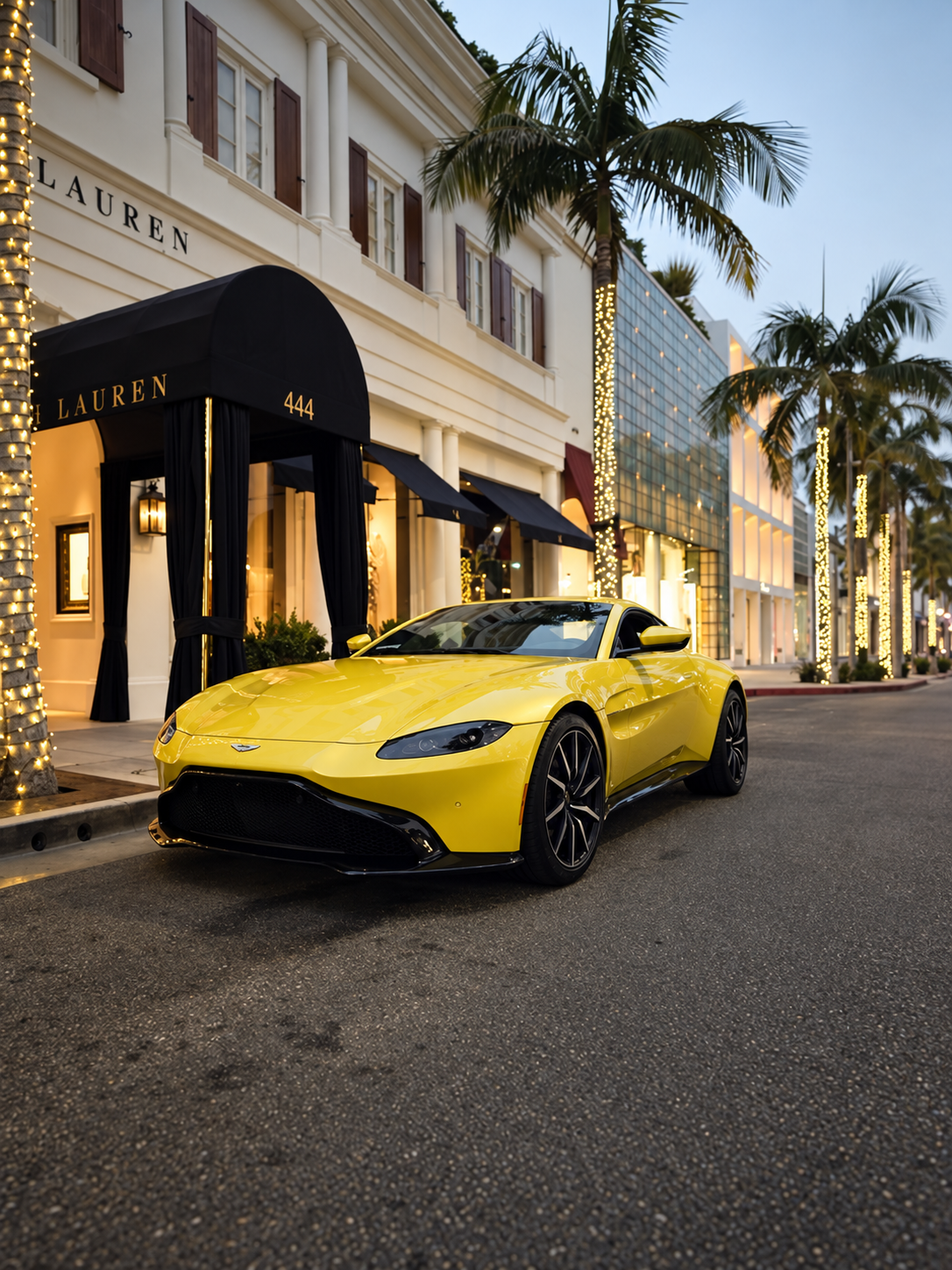 Front view of the yellow Aston Martin Vantage rental, a 503 hp V8 sports car
