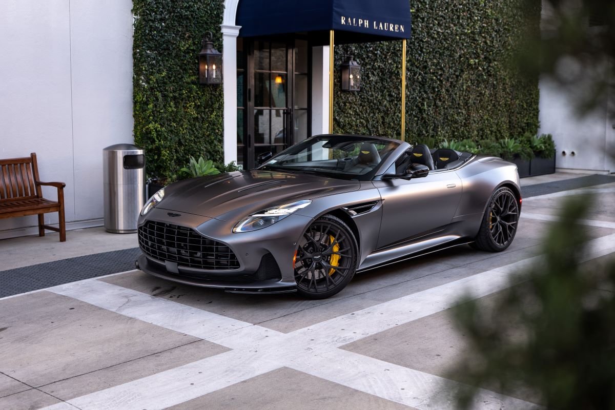 Front view of the grey Aston Martin DB12 Volante rental, a 4 seat convertible grand tourer