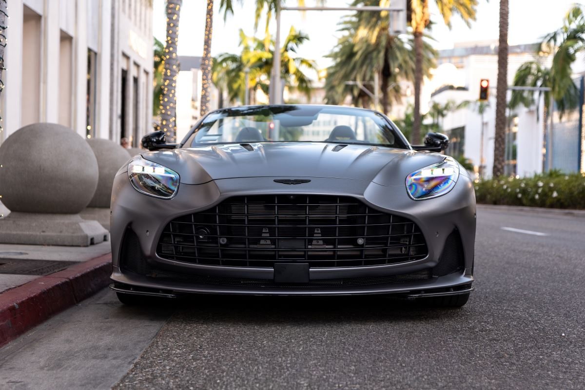 Front view of the Aston Martin DB12 Volante rental in grey, 202 mph top speed