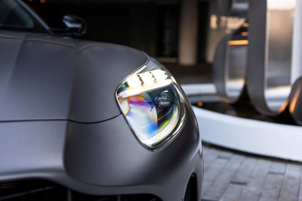 Headlight on the grey Aston Martin DB12 Volante rental