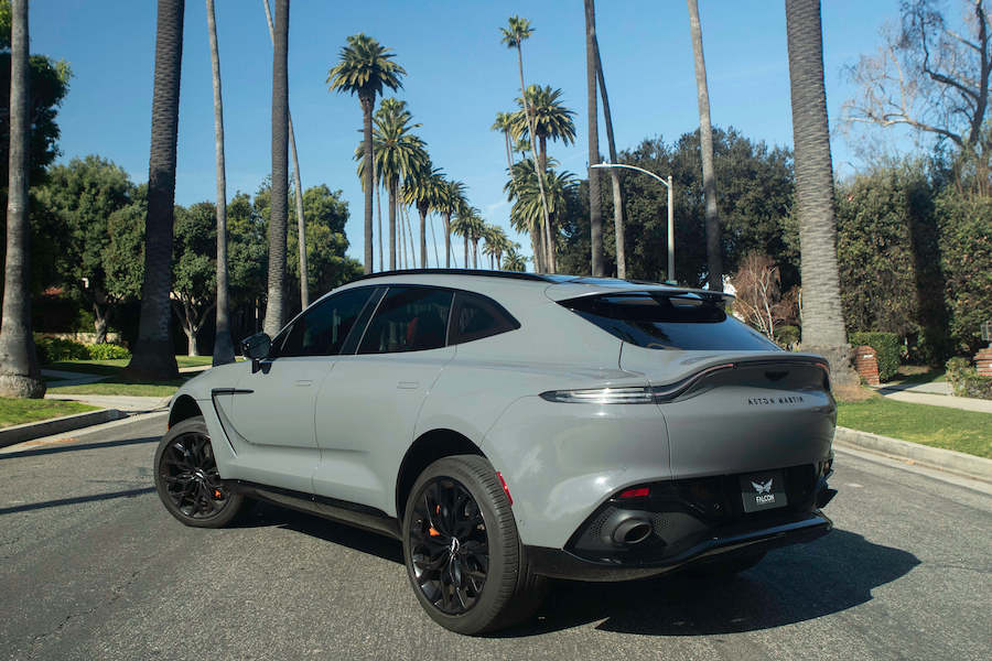 Rear view of the Aston Martin DBX rental in grey, a 4 door luxury SUV