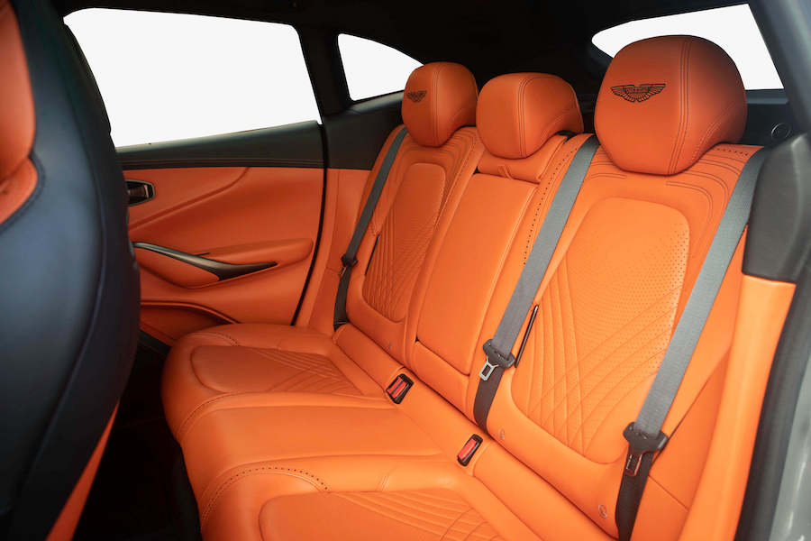Orange rear seats in the Aston Martin DBX rental, seating for 5
