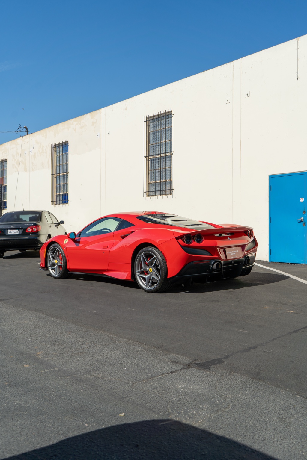 Red Ferrari F8 Tributo RWD supercar rental in San Diego, Black and Red interior