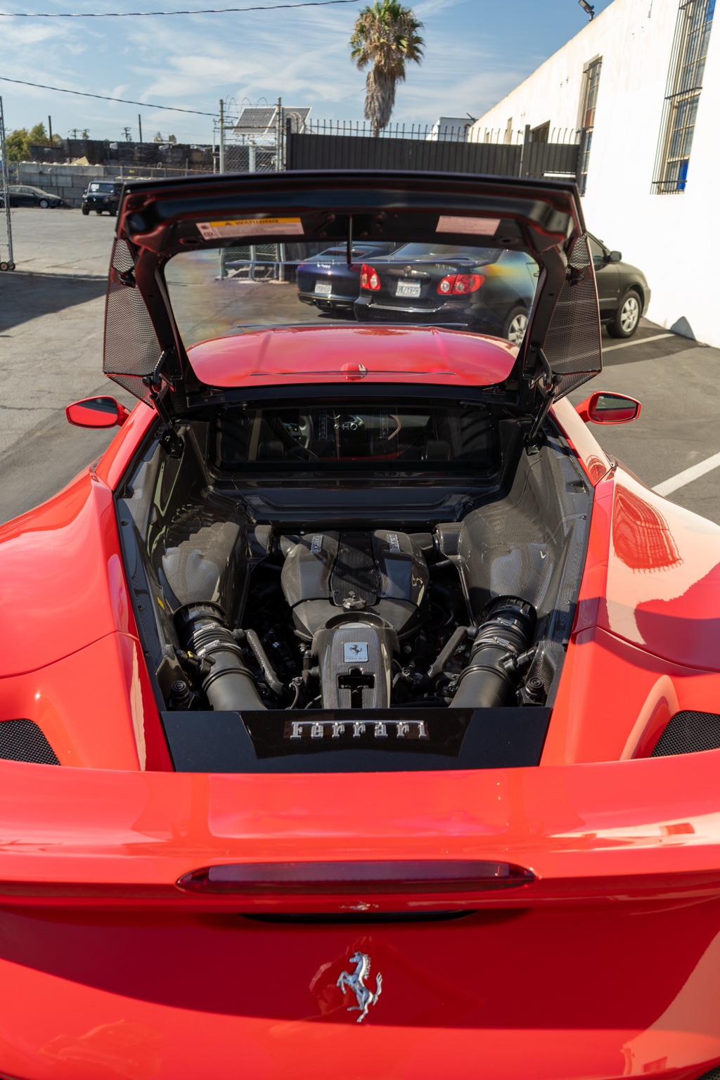 Red Ferrari F8 Tributo 2 seat supercar available in San Diego, Black and Red interior