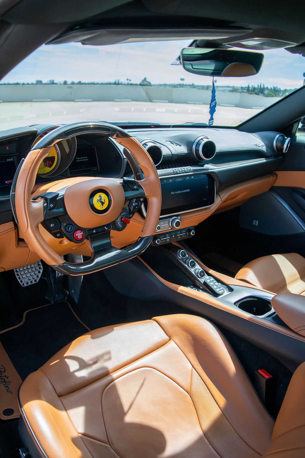 Burgundy Ferrari Portofino Spider supercar available across Orange County