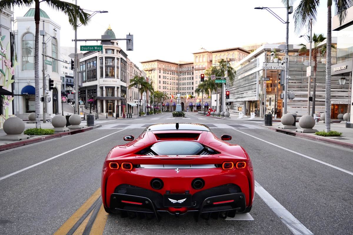 Red Ferrari SF90 Stradale rear view, hypercar for rent in Los Angeles