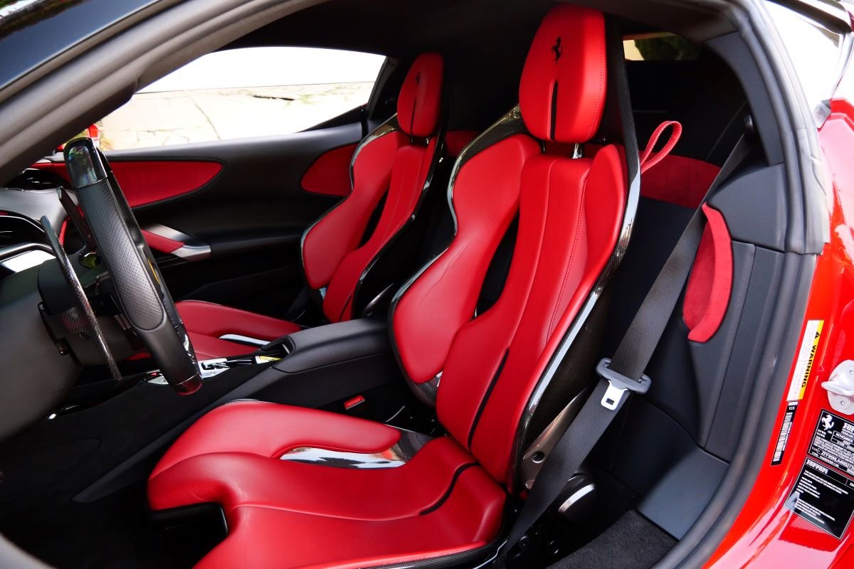 Red Ferrari SF90 Stradale seats, hypercar for rent in Los Angeles