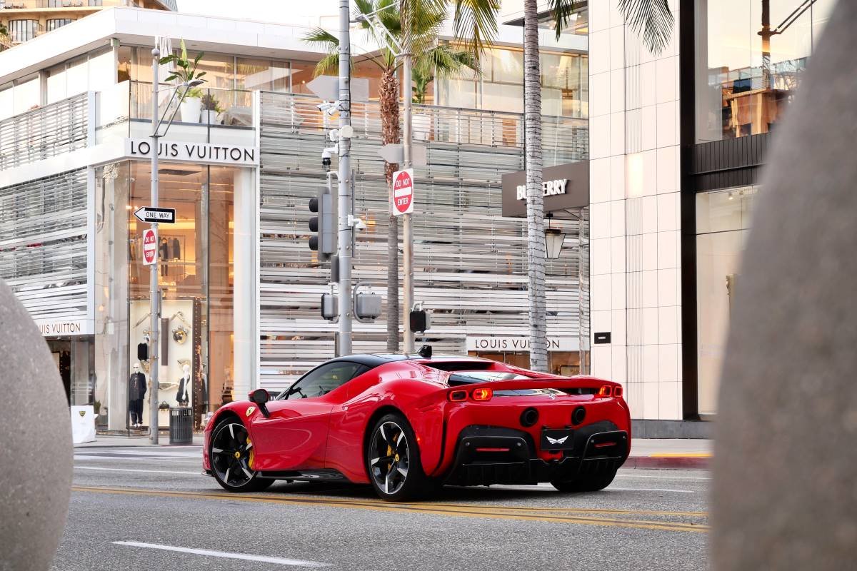 Red Ferrari SF90 Stradale rear view, 2 door hypercar