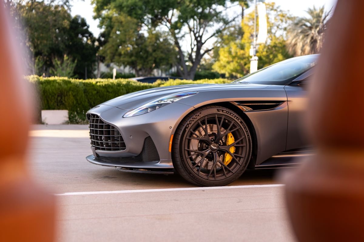Grey Aston Martin DB12 Volante side profile, RWD convertible