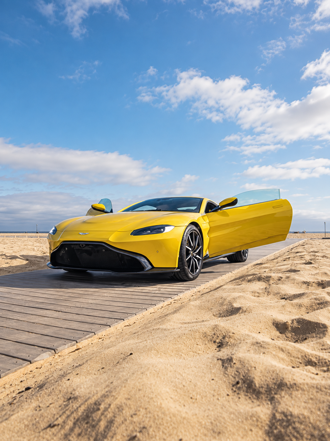 Yellow Aston Martin Vantage side profile, RWD sports car