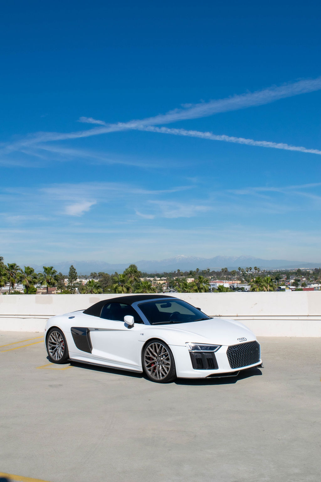 White Audi R8 V10 Spyder supercar rental delivered across Orange County, CA