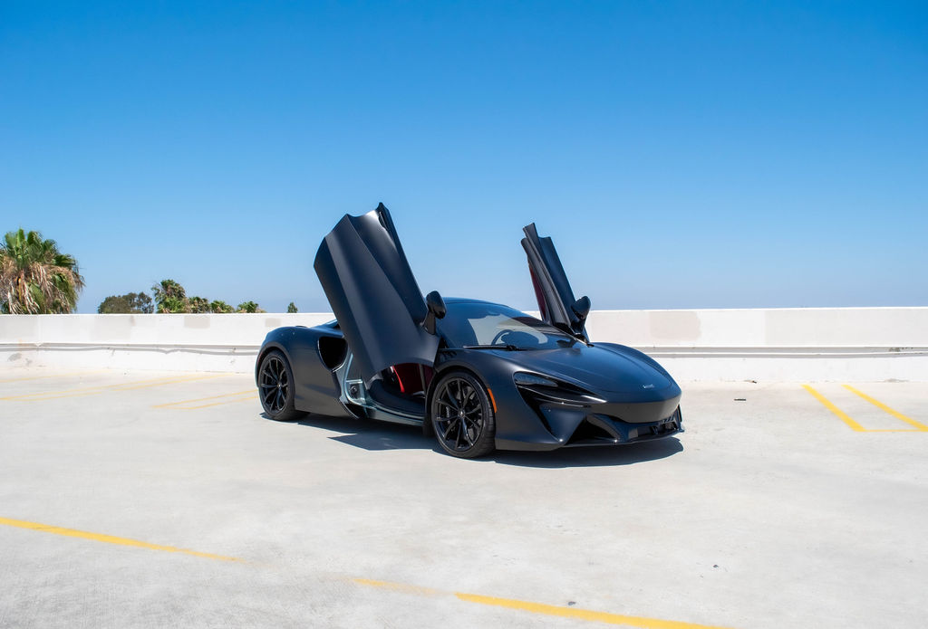Satin Black McLaren Artura Spider rental in Orange County, Red interior