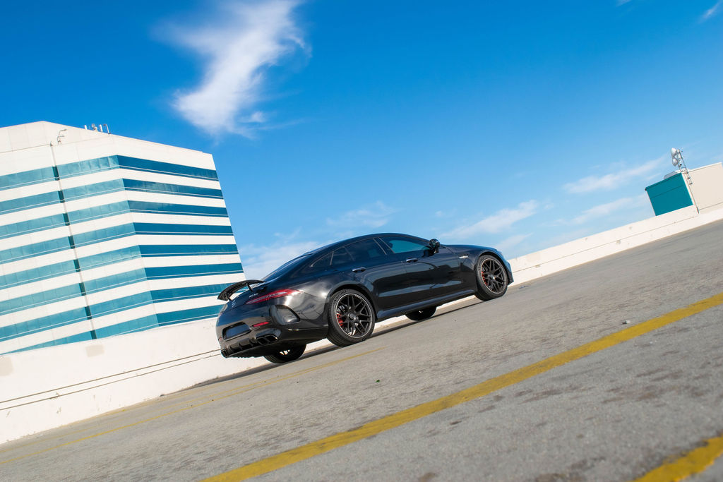 Black Mercedes-Benz AMG GT 63, Luxury Sedan rental, Red interior