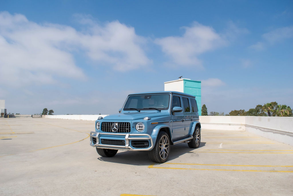 Blue Mercedes-Benz G-Wagon AMG G63 4WD luxury SUV with White interior