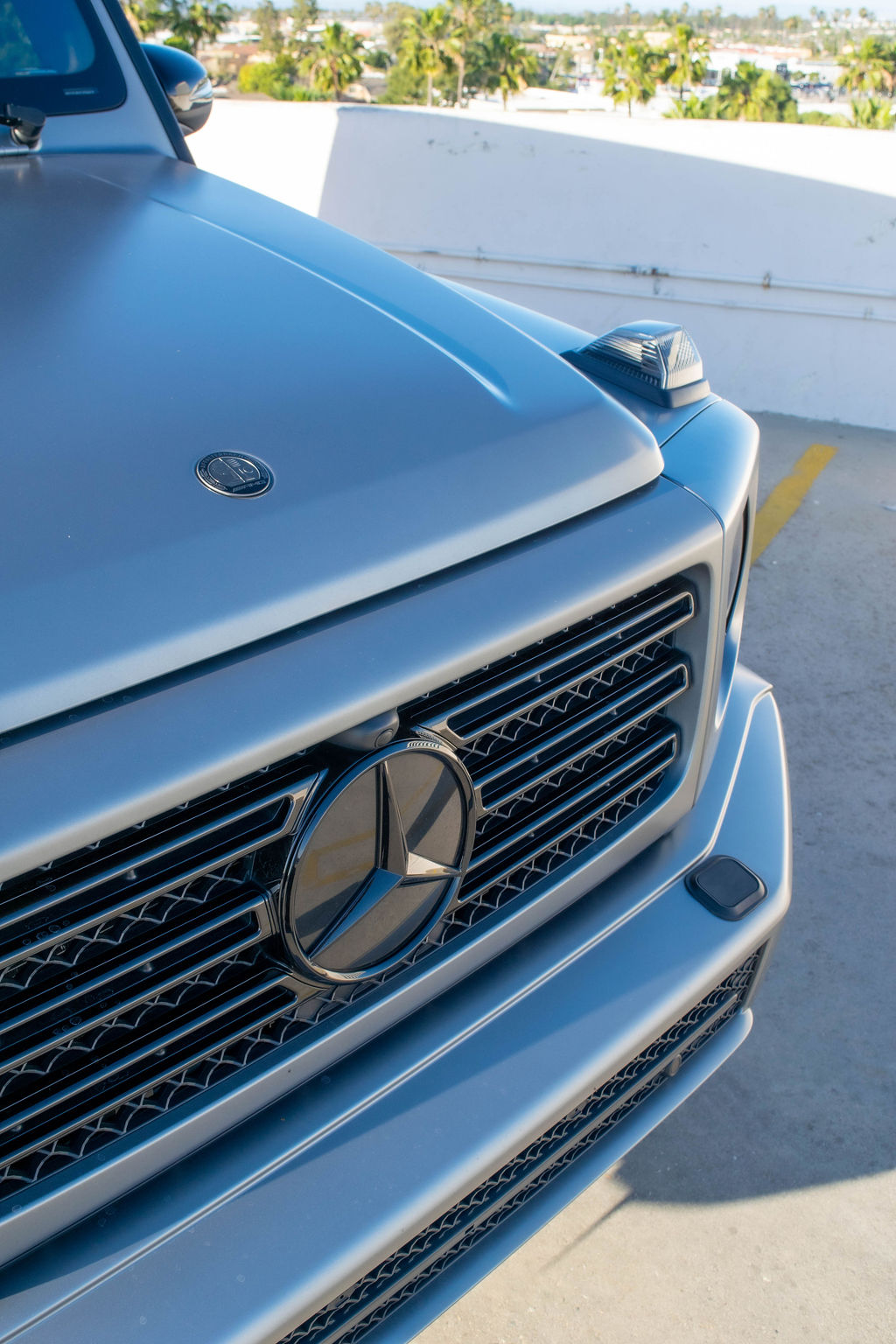 Grey Mercedes-Benz G-Wagon G550 luxury SUV rental in Orange County with Black interior