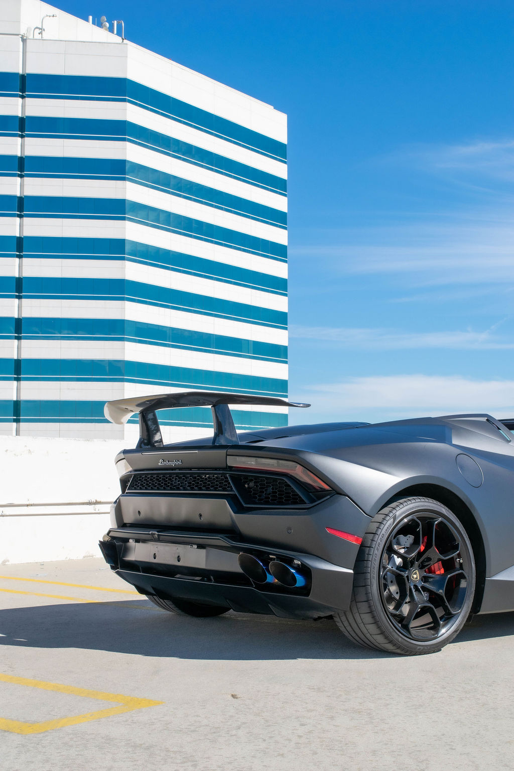 Black Lamborghini Huracan Spyder exotic car rental in Orange County