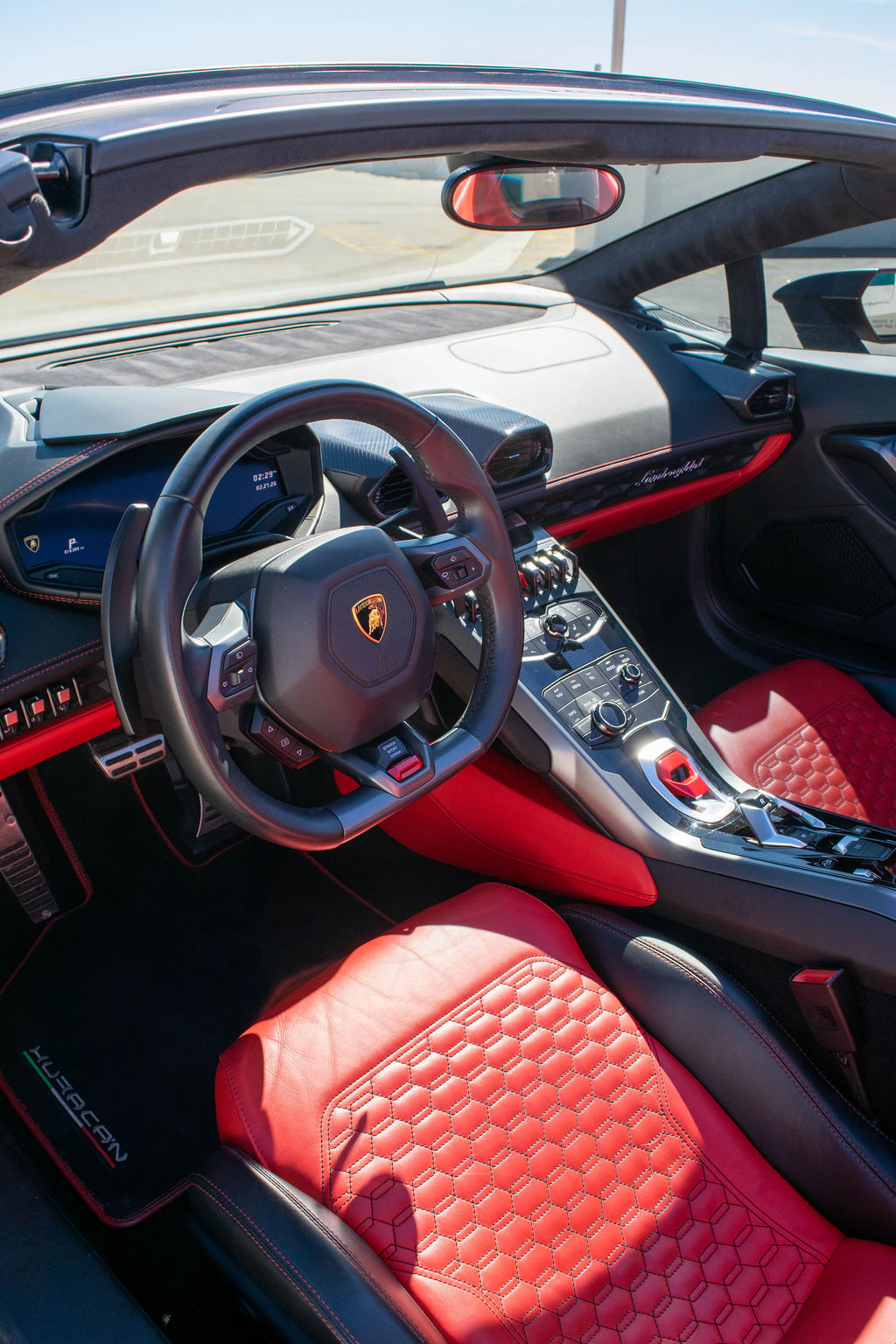 Black Lamborghini Huracan Spyder AWD supercar with Red interior