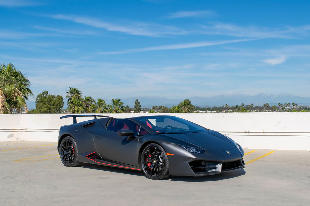 Black Lamborghini Huracan Spyder Red interior, supercar rental in Orange County