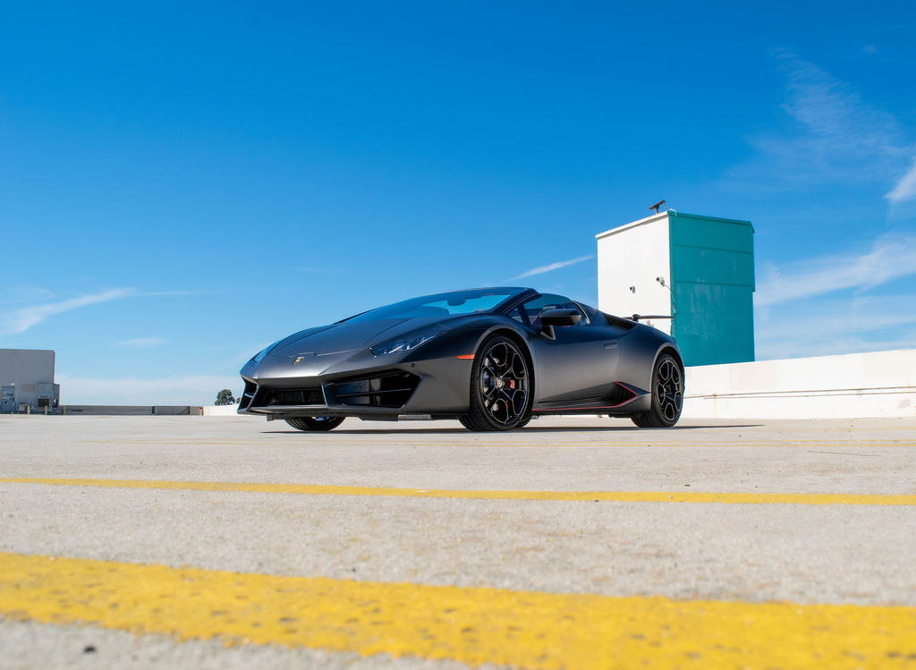 Black Lamborghini Huracan Spyder supercar, Red interior and 2 seats