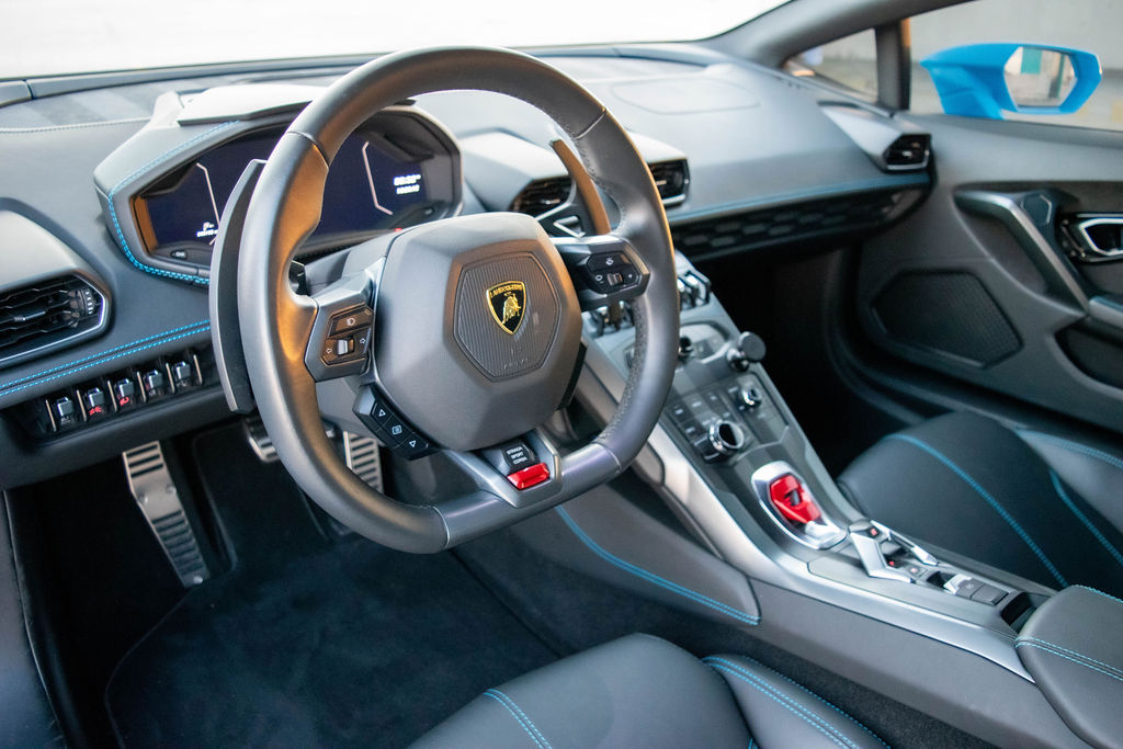 Pink Lamborghini Huracan supercar rental in Orange County with Black interior
