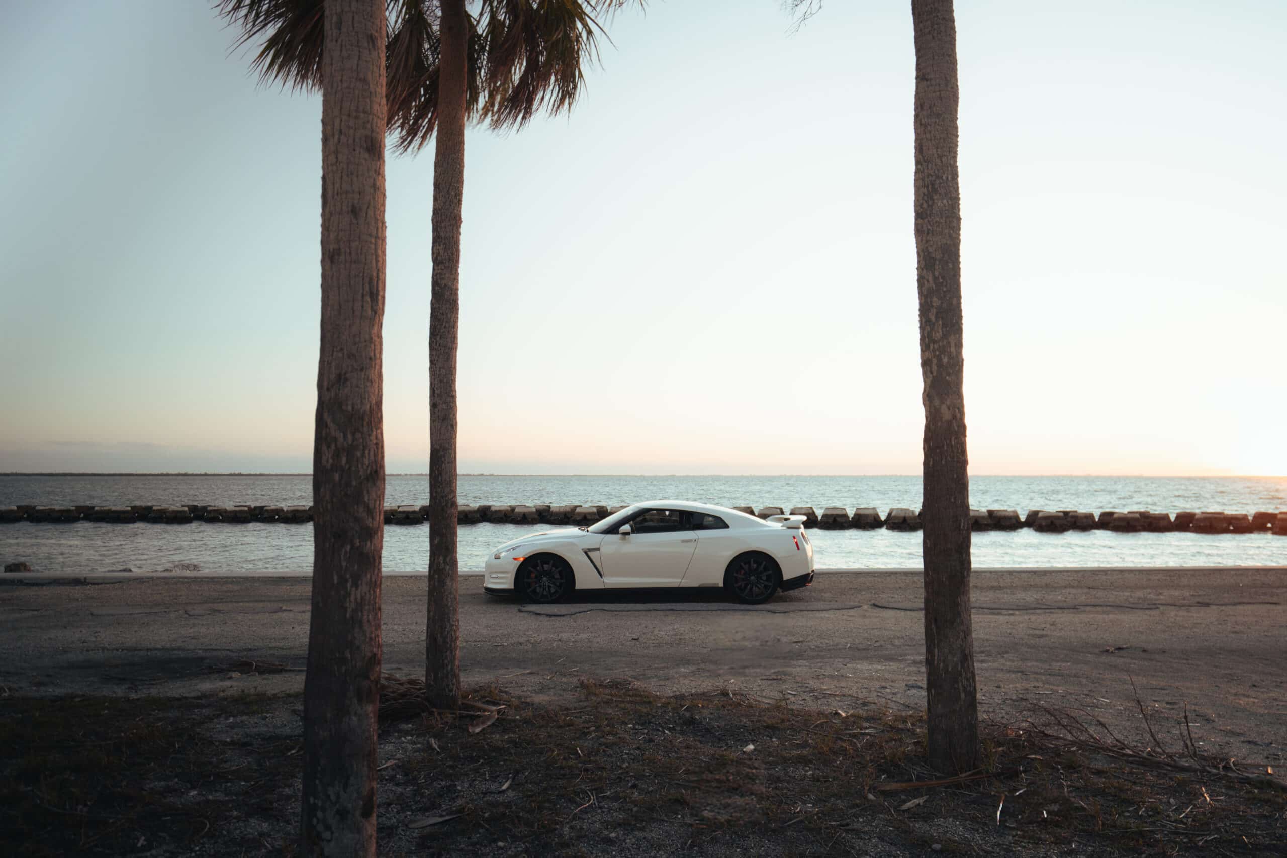 White Nissan GT-R side view, 4 seats, AWD
