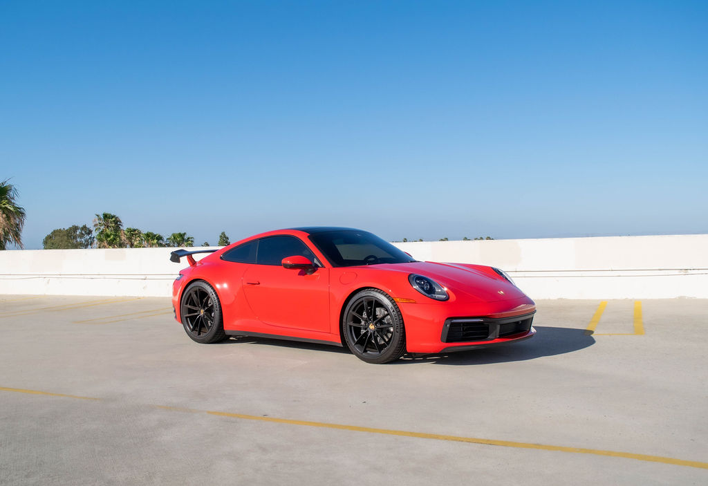 Red Porsche 911 Carrera rental in Orange County, Black interior