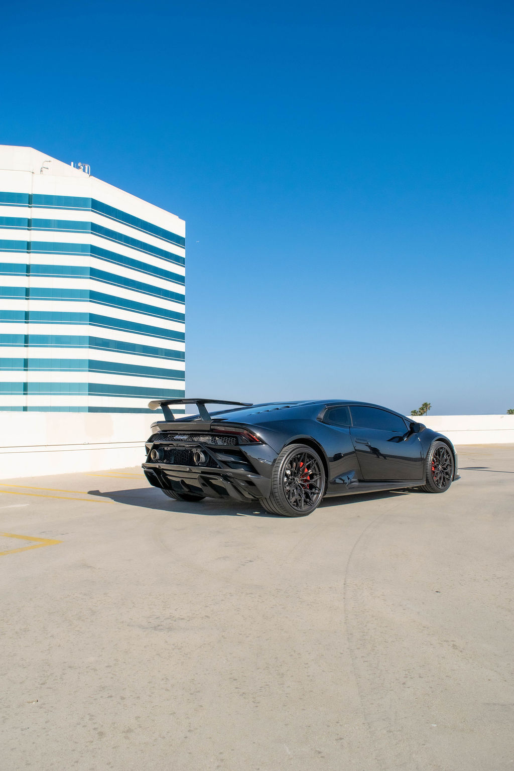 Black Lamborghini Huracan Evo AWD supercar with Black and Red interior