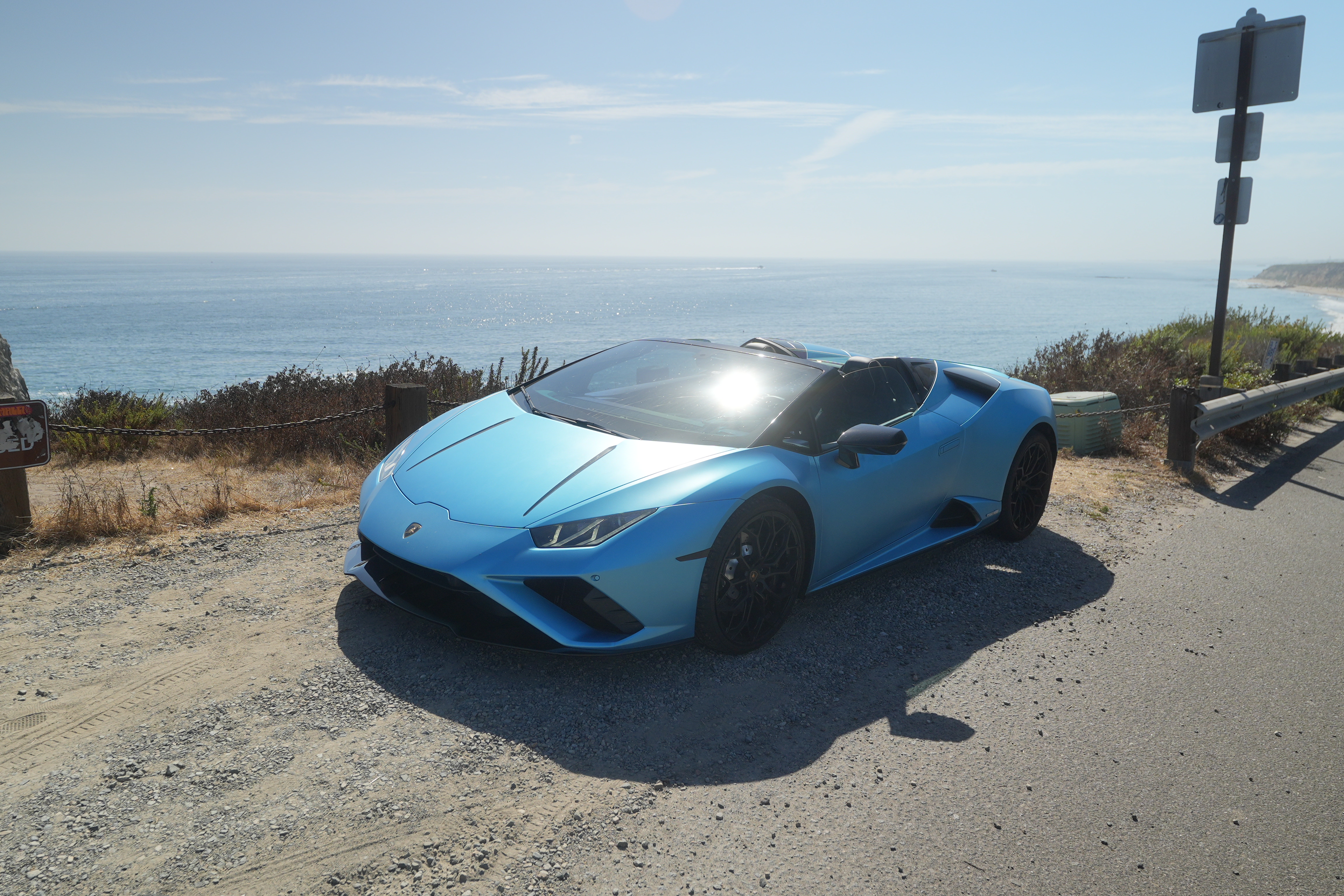 Blue Lamborghini Huracan Evo Spyder convertible supercar for rent in Orange County