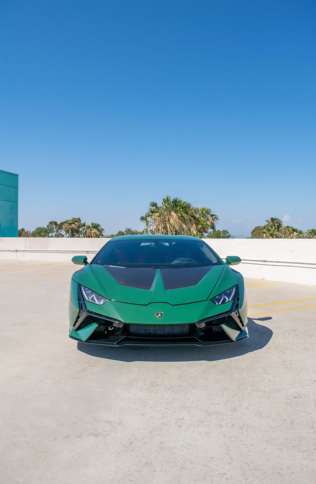 Green Lamborghini Huracan supercar with Black interior