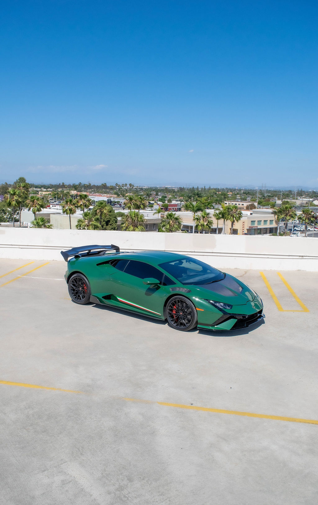 Green Lamborghini Huracan exotic car rental in Orange County