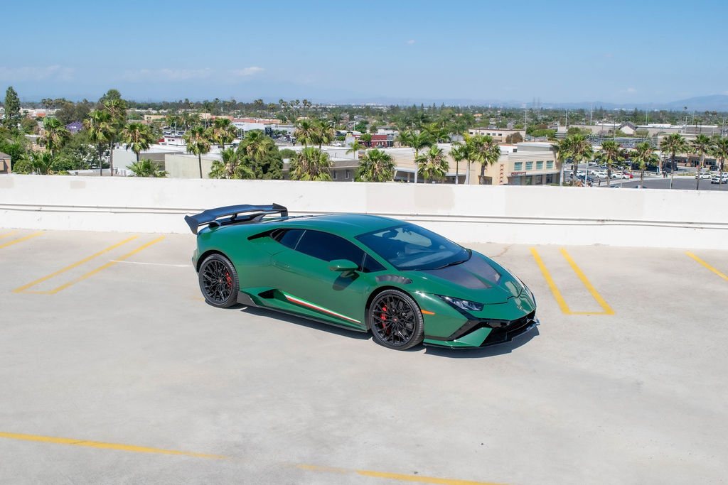 Green Lamborghini Huracan supercar rental delivered in Orange County