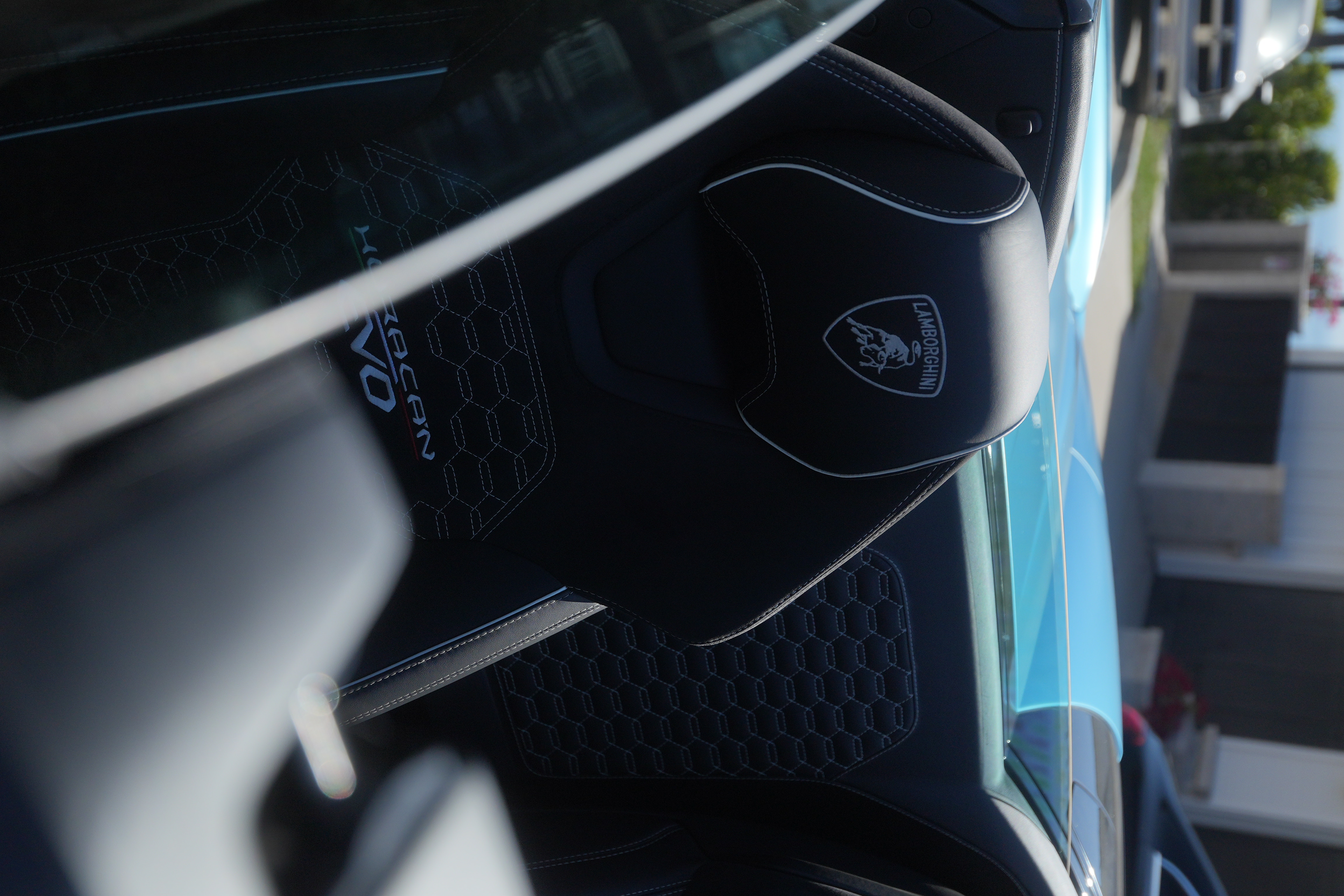Blue Lamborghini Huracan Evo Spyder convertible supercar rental in Orange County
