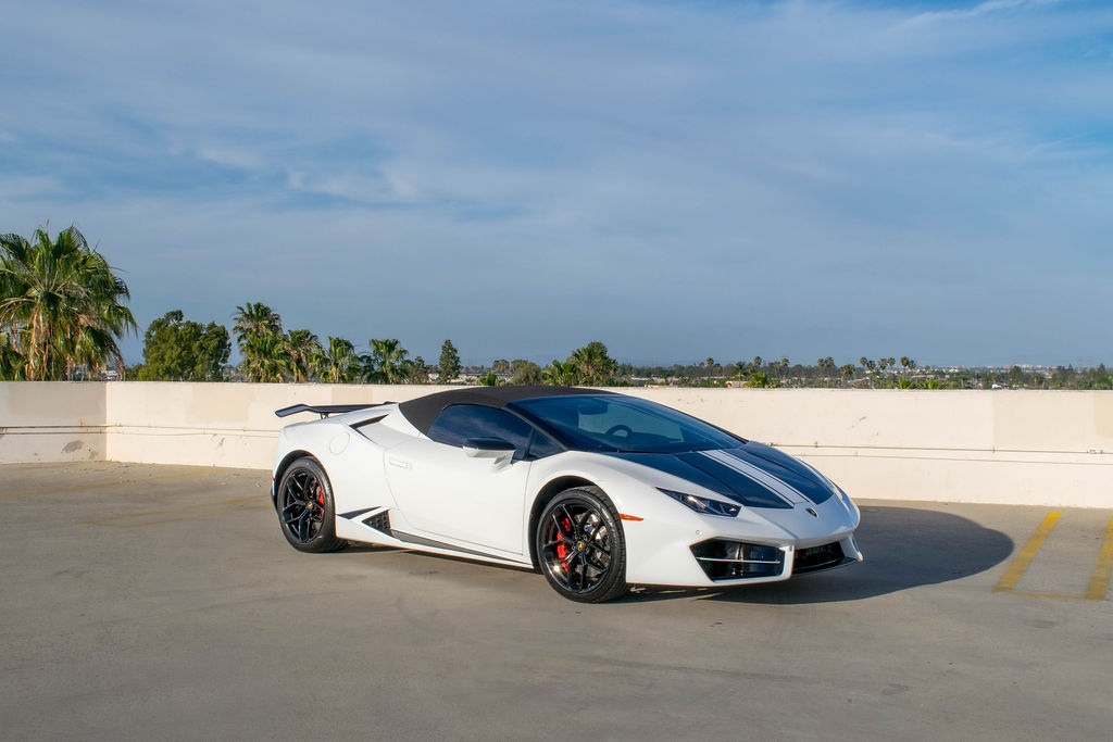 White Lamborghini Huracan Spyder convertible supercar for rent in Orange County