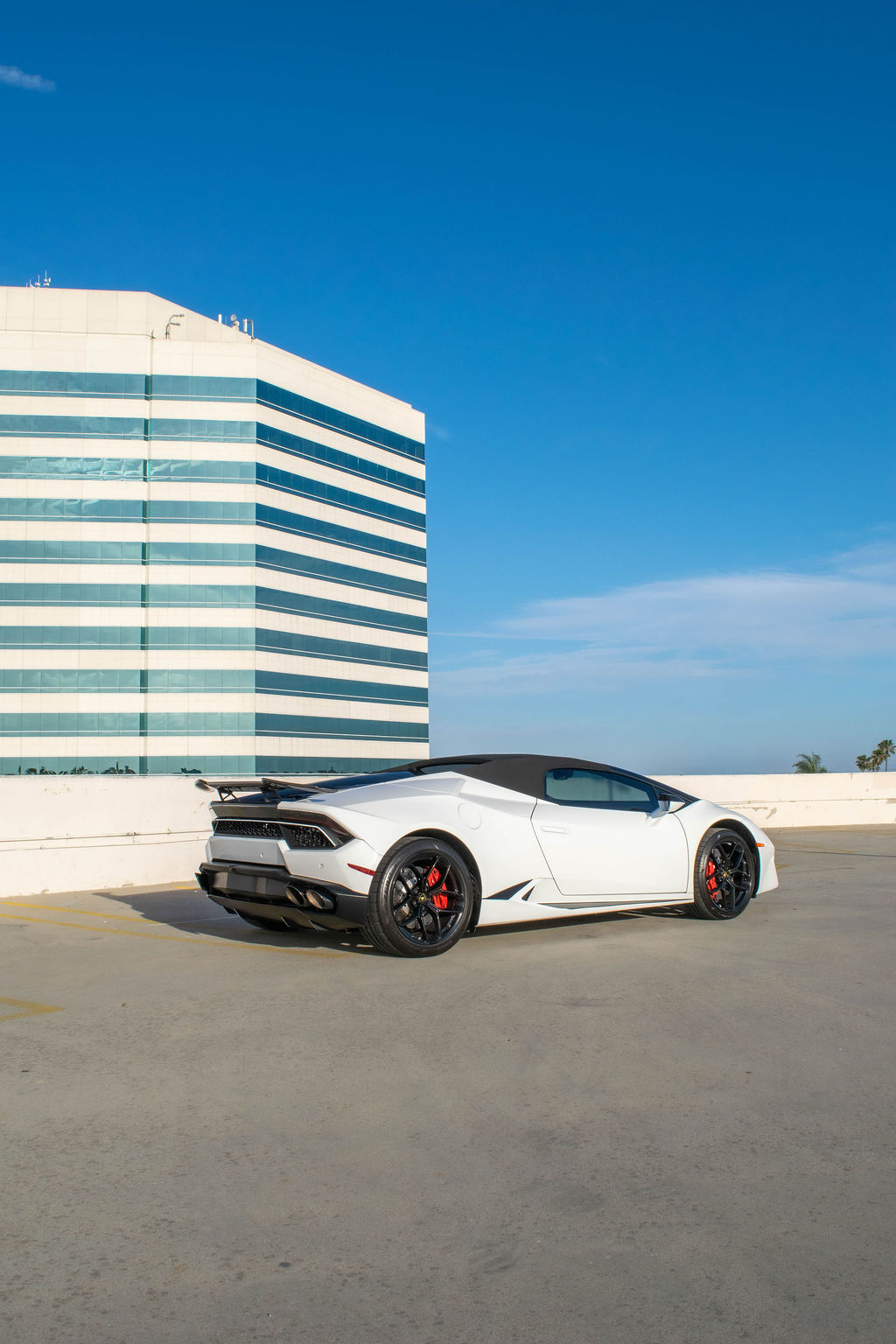 White Lamborghini Huracan Spyder open top supercar with Black and Red interior