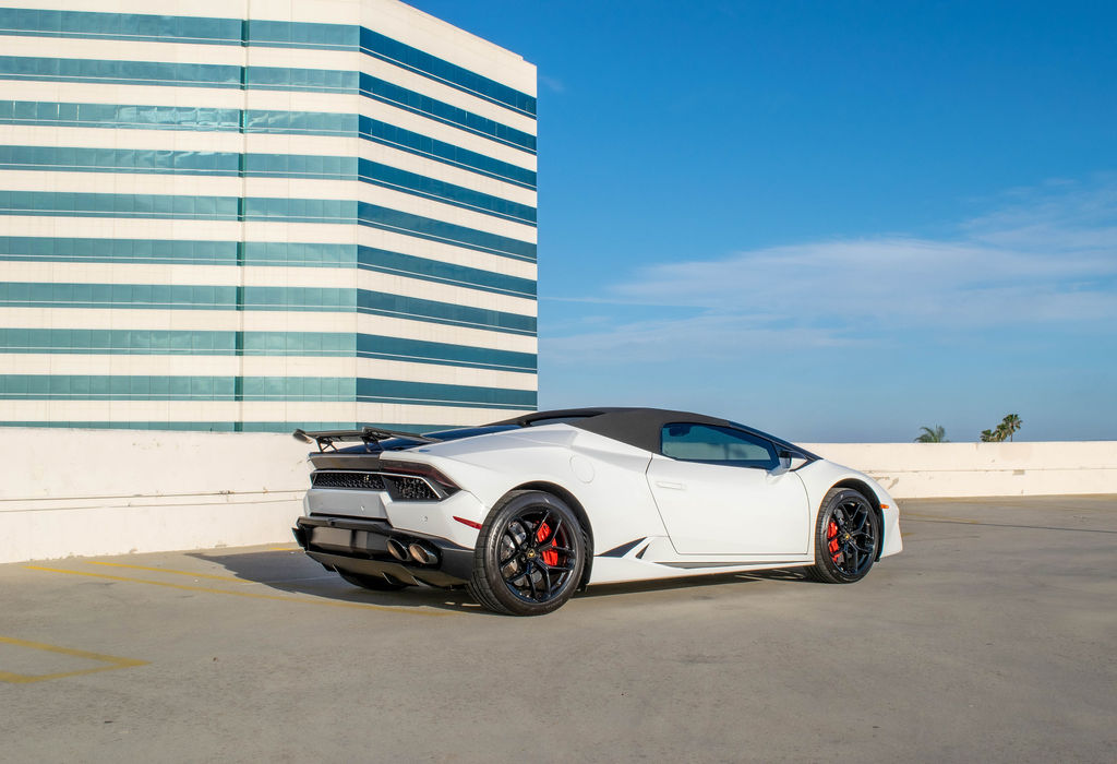 White Lamborghini Huracan Spyder convertible supercar rental in Orange County
