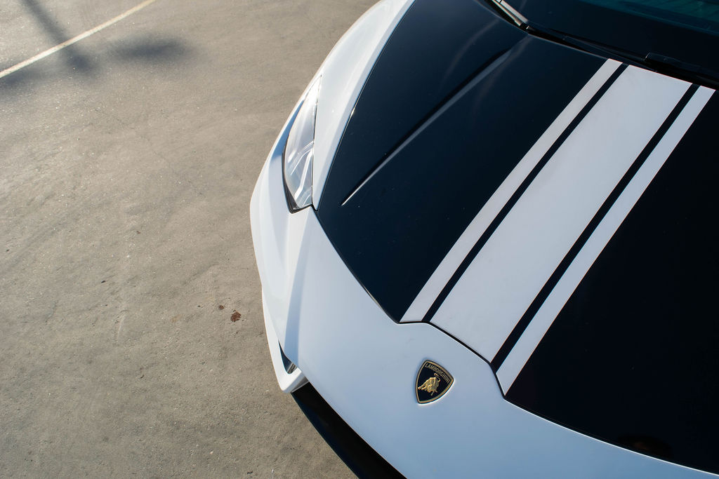White Lamborghini Huracan Spyder AWD supercar rental in Orange County