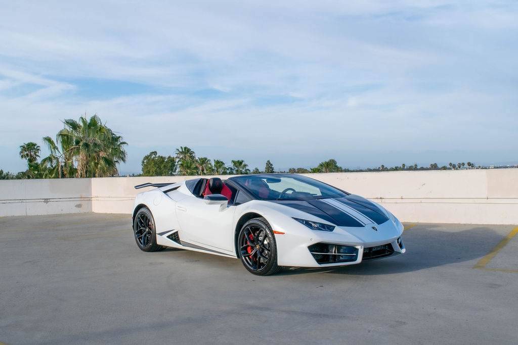 White Lamborghini Huracan Spyder supercar with Black and Red interior