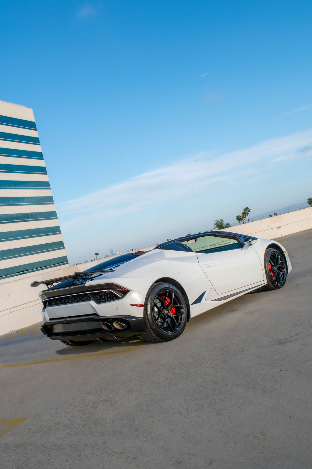 White Lamborghini Huracan Spyder AWD supercar with Black and Red interior