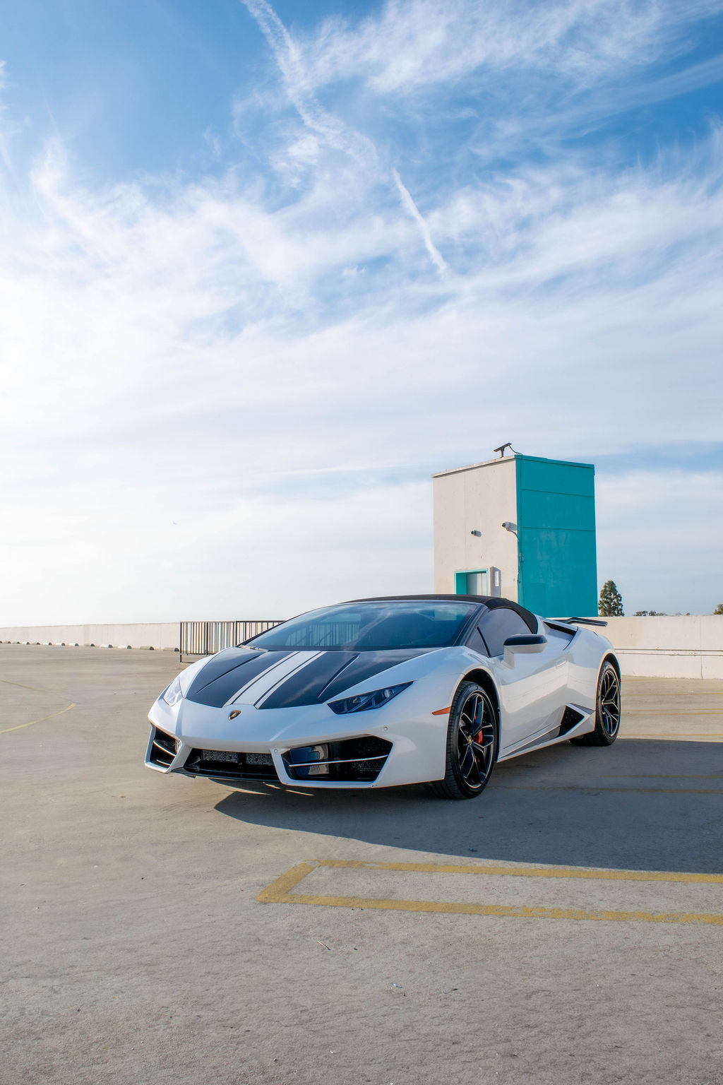 White Lamborghini Huracan Spyder supercar rental in Orange County with Black and Red interior