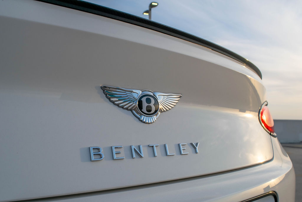 White Bentley Continental GTC luxury sedan available to rent across Orange County, CA, Red interior