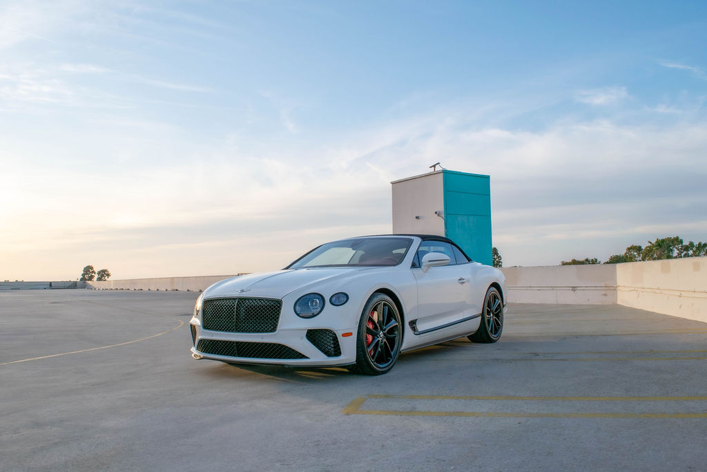 White Bentley Continental GTC with AWD drivetrain, luxury sedan rental in Orange County, Red interior