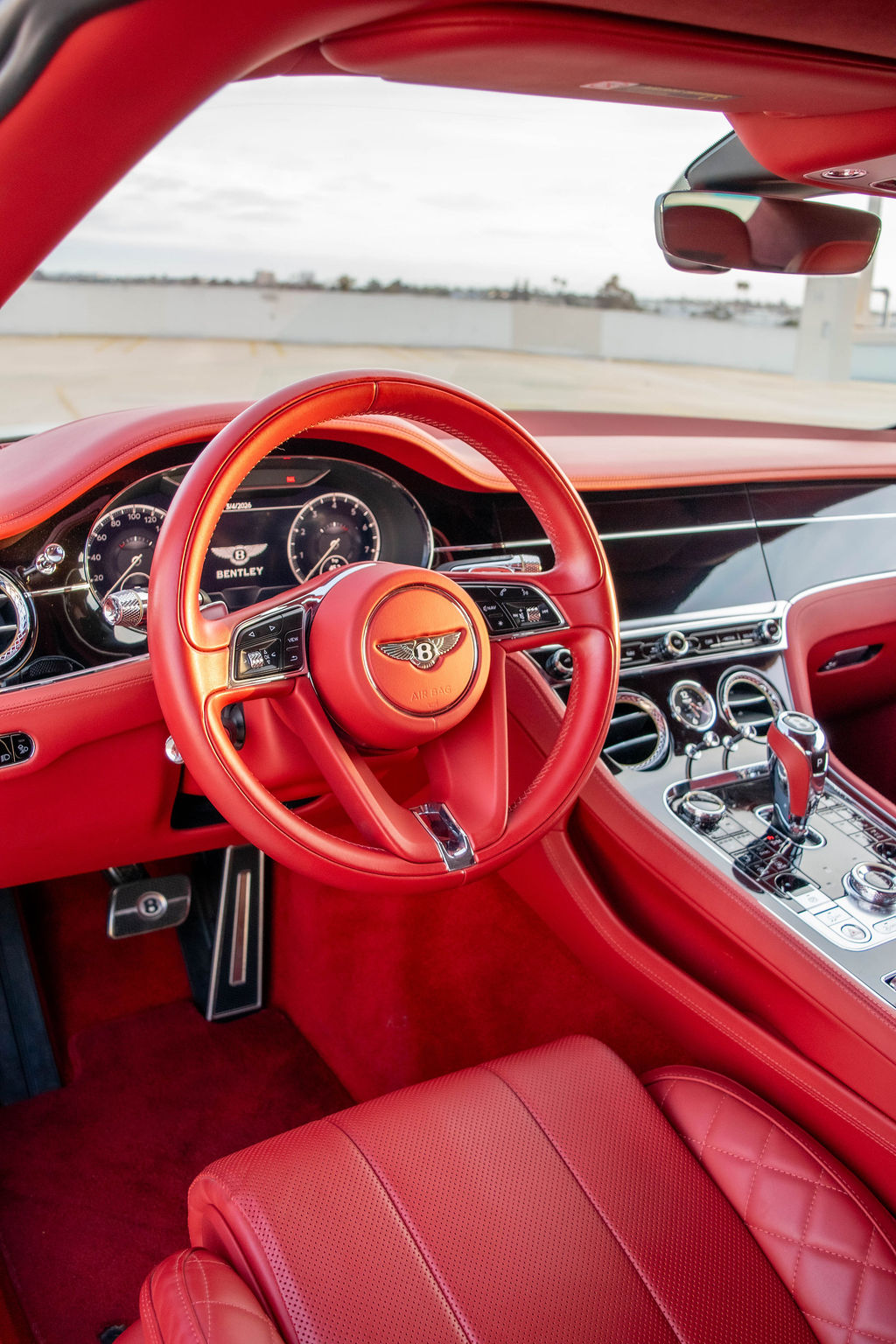 Bentley Continental GTC luxury sedan in White, available for rental in Orange County, CA, Red interior