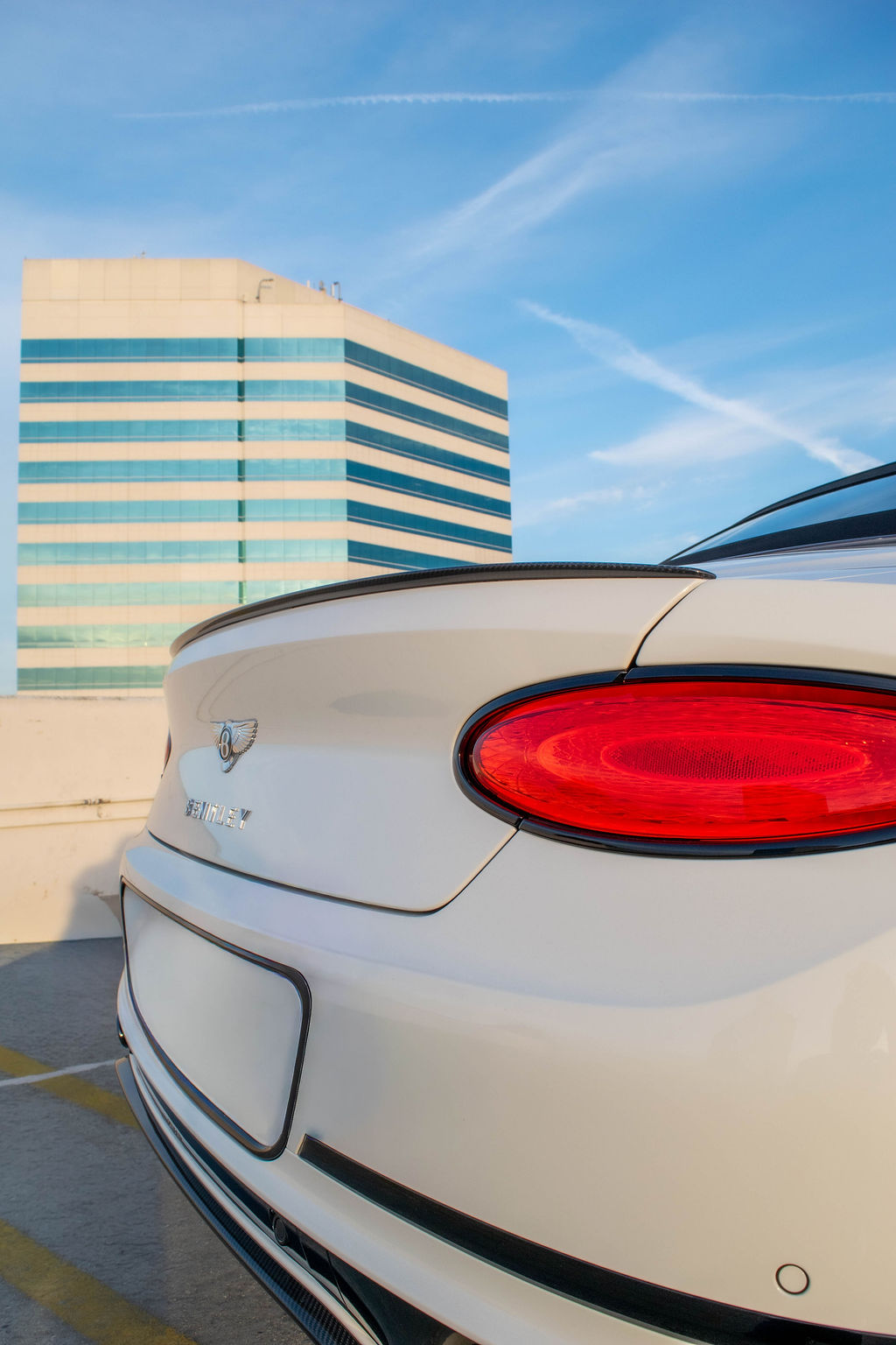 White Bentley Continental GTC, a 2 door luxury sedan for hire in Orange County, Red interior