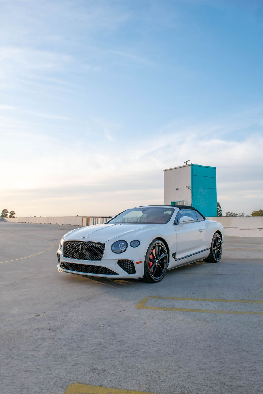 White Bentley Continental GTC luxury sedan rental delivered across Orange County, CA, Red interior