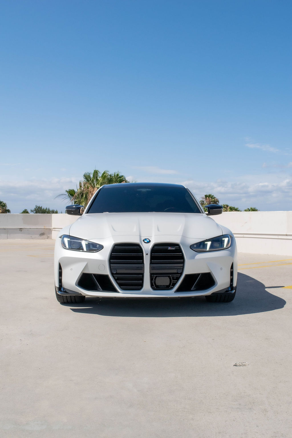 White BMW M3 Competition with AWD drivetrain, sports car rental in Orange County