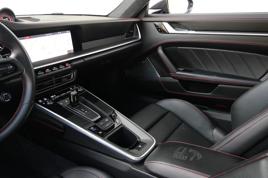 Black Porsche 911 Turbo S center console, AWD 4 seat rental