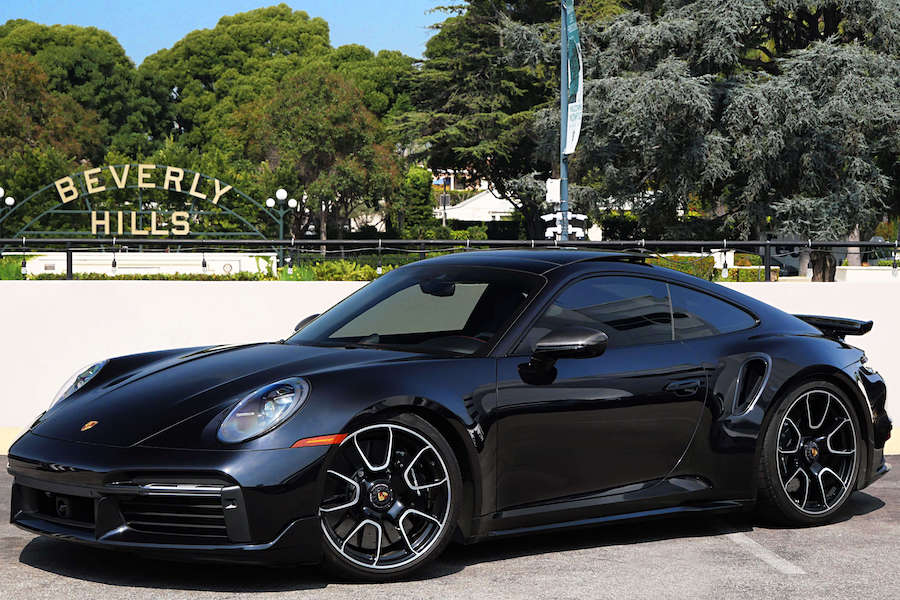 Black Porsche 911 Turbo S side view, AWD Sports Car rental