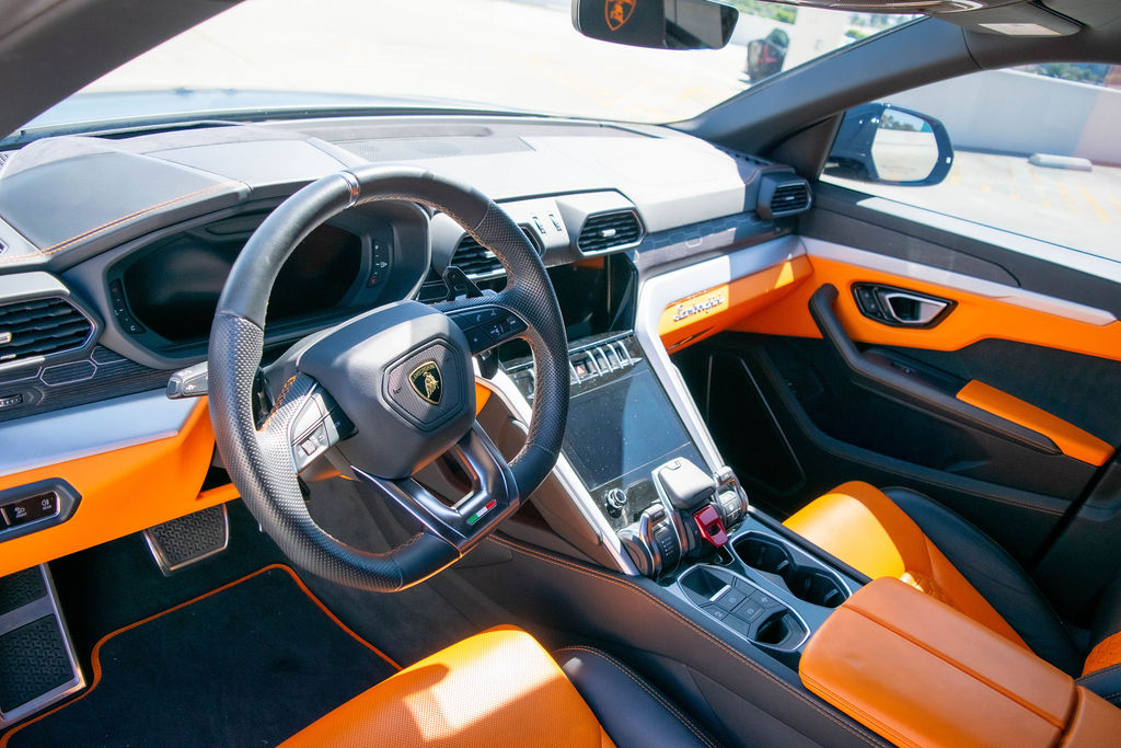 Black Lamborghini Urus luxury SUV with Orange interior