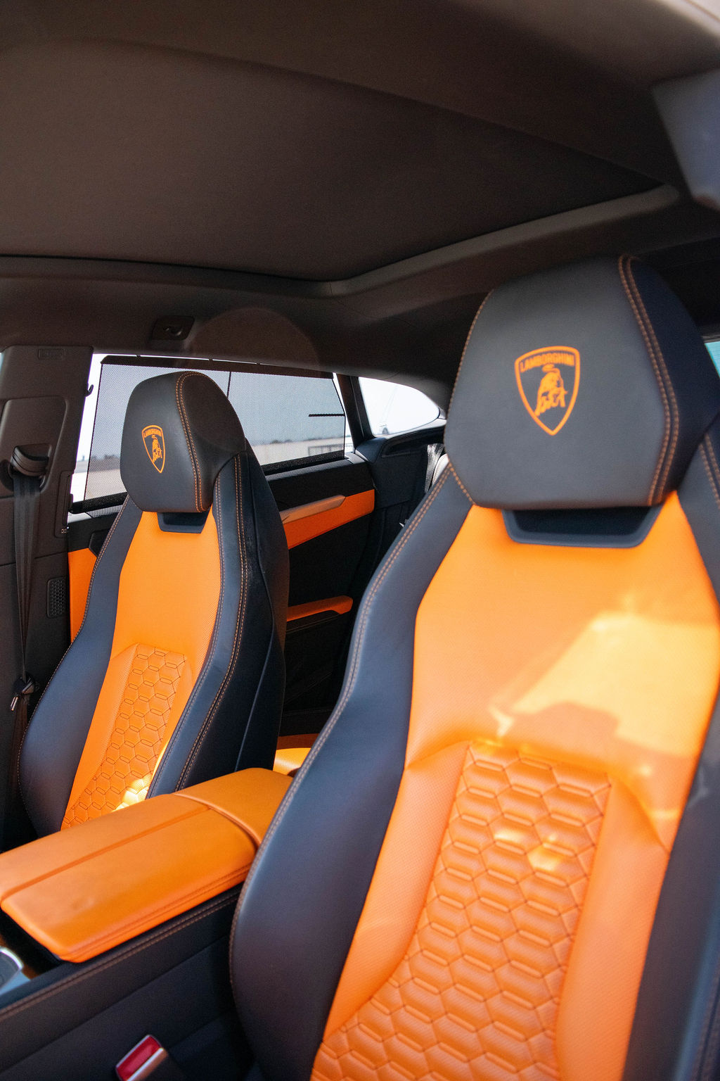 Black Lamborghini Urus AWD luxury SUV with Orange interior
