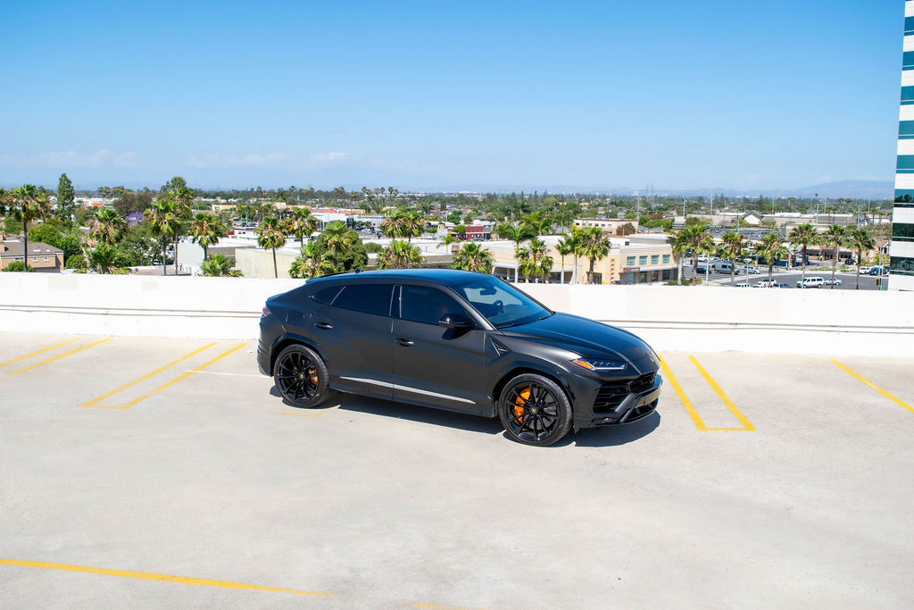 Black Lamborghini Urus from the front three quarter, the best car for a night out in LA